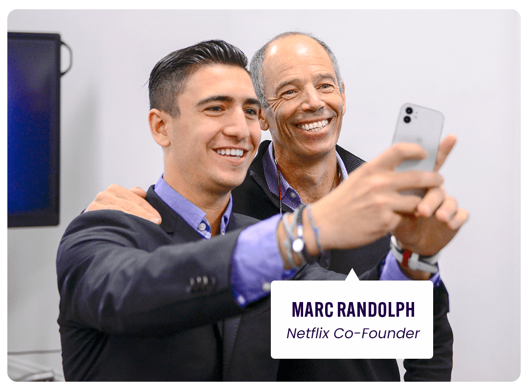 Student taking a selfie with Marc Randolph, Netflix co-founder.