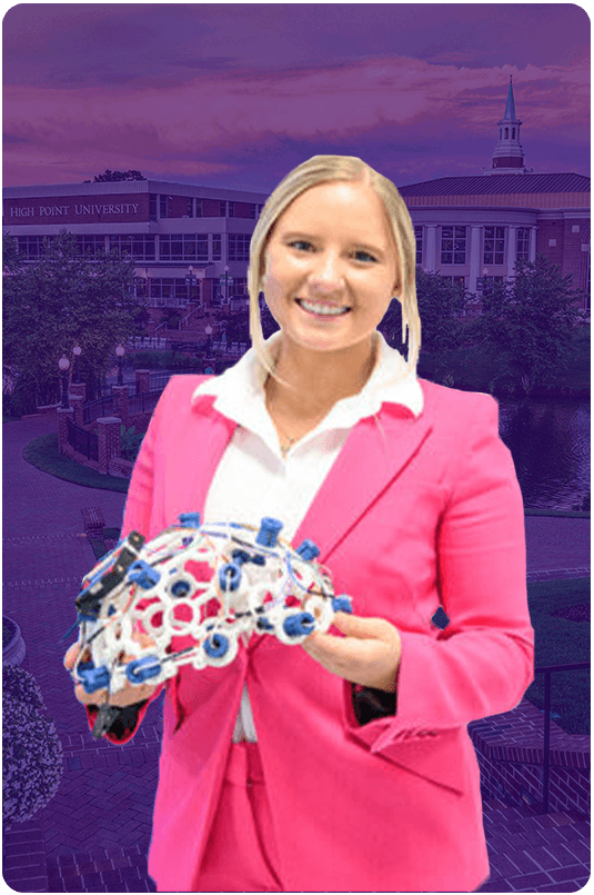 Hanna Zelis ’24 smiling and holding a bouquet.