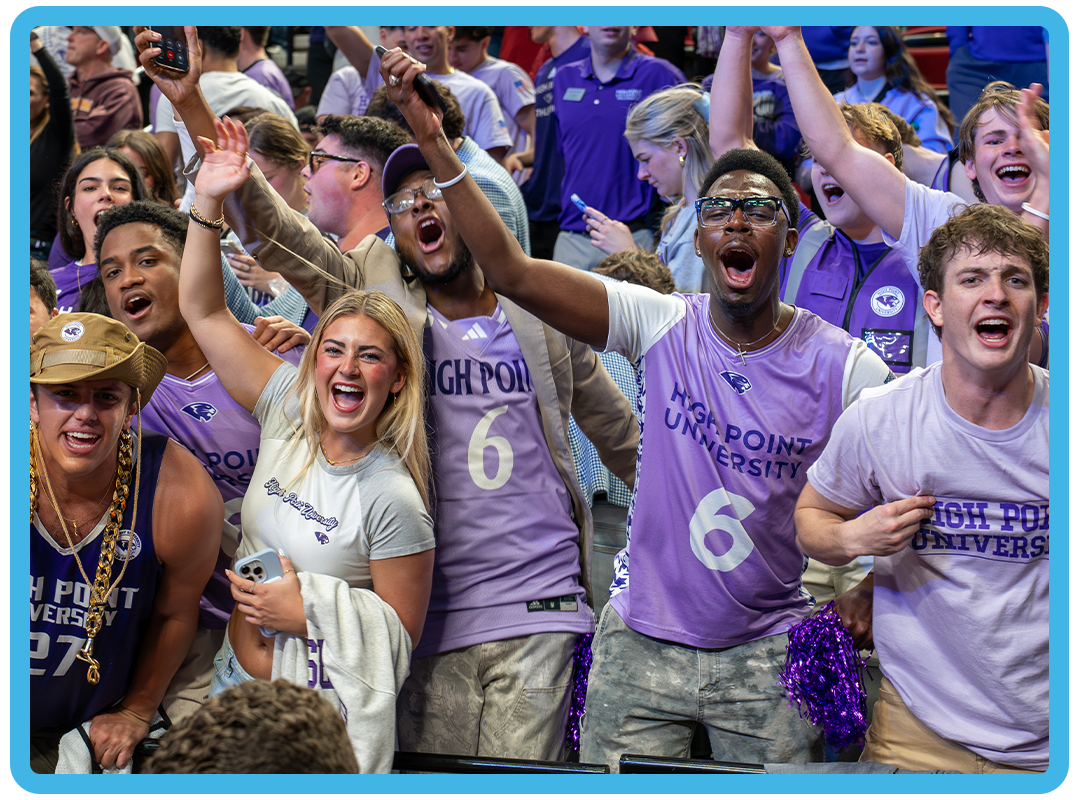 Students cheering at a sporting event.